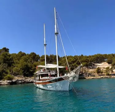 Luxury Gulet anchored in a secluded turquoise cove near Brač island, Croatia