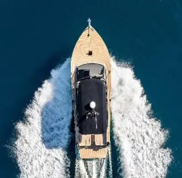 Aerial top-down view of a luxury speedboat cruising on deep blue Adriatic Sea near Split, Croatia