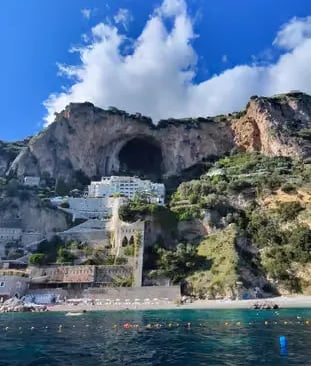 Conca dei Marini coastline with dramatic sea cave and cliffs seen from Amalfi Coast boat tour