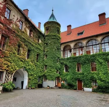 Ivy-covered medieval castle courtyard with a turret in Bohemian Paradise Czech Republic
