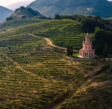 Historic church nestled among terraced Prosecco vineyards in Conegliano Valdobbiadene hills
