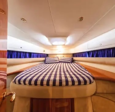 Cranchi 39 luxury yacht cabin interior with double bed and Italian wood finish design