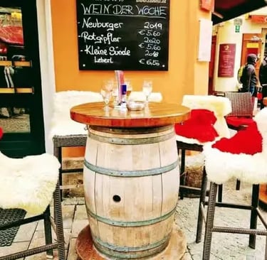 A cozy outdoor cafe in Graz with festive decorations on the chairs.