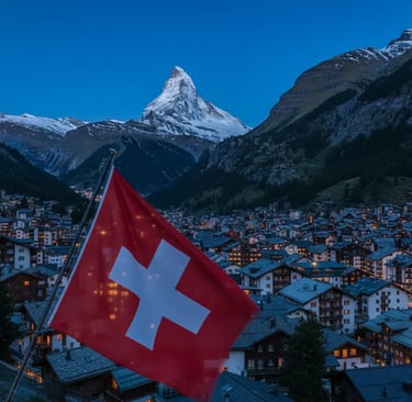 A Swiss flag waving in the foreground, with the iconic Matterhorn mountain and the snow-covered vill