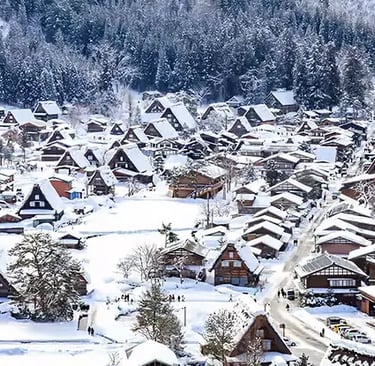 Aerial view of Shirakawa-go village covered in deep winter snow.