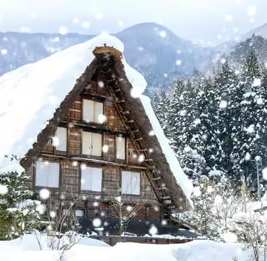 Heavy snow falling on a traditional Gassho-style farmhouse roof.