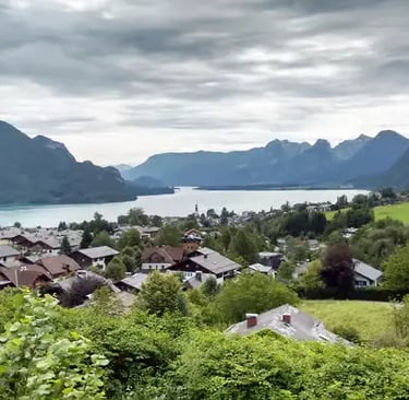 Stunning panoramic view of Austrian mountains and blue lakes.