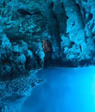 Glowing blue water inside the Blue Cave on Biševo Island during morning Croatia boat tour