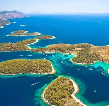 Aerial view of Pakleni Islands archipelago near Hvar with turquoise Adriatic sea and green coves