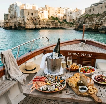 Italian seafood lunch and Apulian sparkling wine served on boat deck near Polignano a Mare
