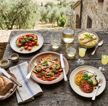 Four-course Italian meal with ravioli mozzarella bruschetta and limoncello at farmhouse table
