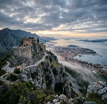 Klis Fortress perched on rocky ridge above Split with morning mist and Adriatic Sea view