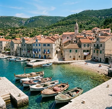 Komiža fishing village waterfront with traditional boats and stone houses on Vis Island, Croatia