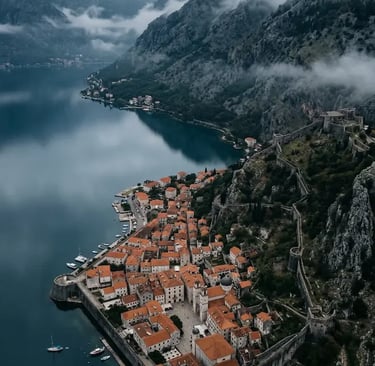 Kotor Bay Montenegro aerial view with medieval walls and mountains