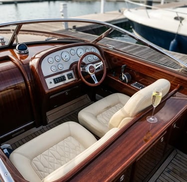 Riva Aquariva polished mahogany dashboard with cream leather seat and prosecco glass at dock