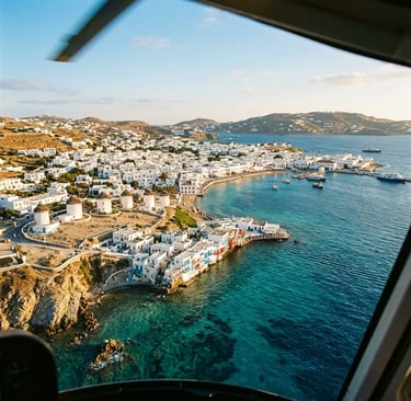 Mykonos windmills and Little Venice coastline seen from approaching helicopter