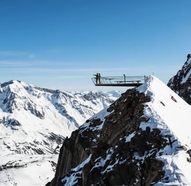 Modern mountain observation deck with panoramic view of snowy Austrian Alps.