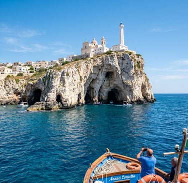 Tourists on boat exploring Santa Maria di Leuca sea caves under the lighthouse and basilica