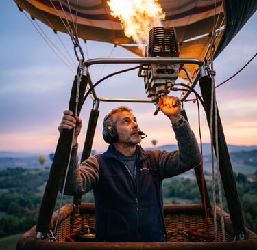 Focused hot air balloon pilot with headset firing burner flame during sunrise flight over Italy.