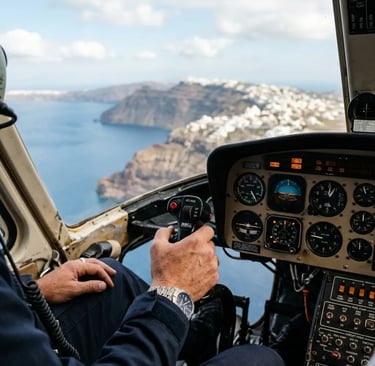 Private pilot hand on Bell 206 cyclic control flying over Santorini cliffs