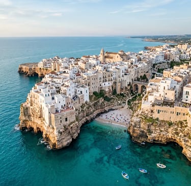 Polignano a Mare white buildings on limestone cliffs above turquoise Adriatic Sea, Puglia