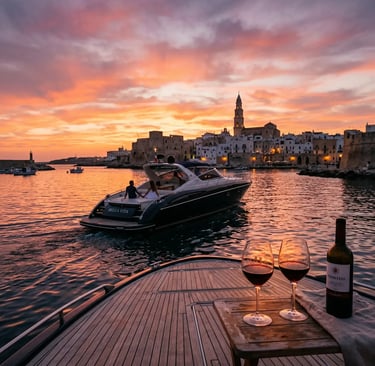 Luxury boat at sunset in Monopoli harbor with Primitivo wine glasses and Puglia skyline view