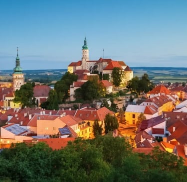 Panoramic view of Mikulov Castle and red-roofed houses in South Moravia during twilight, a popular private day from Prague.