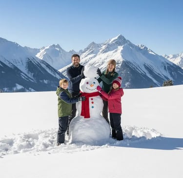 A happy family of four posing next to a large snowman on a snowy mountain with peaks in the backgrou