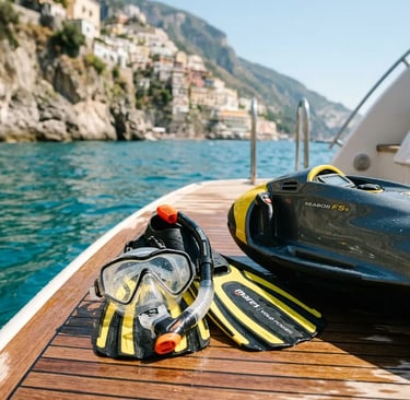 Snorkel gear and Sea Scooter on a teak swim platform with Amalfi Coast waters behind