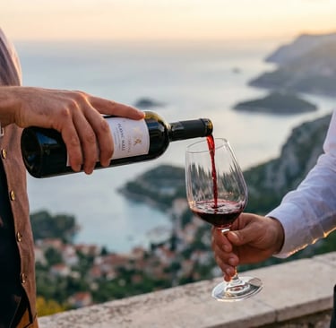 Sommelier pouring Croatian Plavac Mali red wine with Adriatic coastline view at golden hour