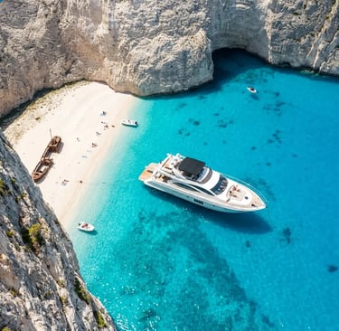 Aerial view of luxury yacht anchored near White Beach and cliffs in Zakynthos