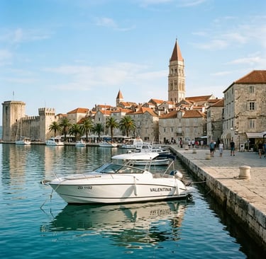 Luxury speedboat moored at Trogir stone promenade with cathedral bell tower in background