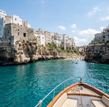 Private boat approaching Lama Monachile cove beach in Polignano a Mare, Monopoli Italy