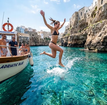 Happy woman jumping from Adriatic Blue tour boat into clear turquoise water near Polignano cliffs