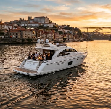 Luxury yacht Douro Star cruising the Douro River in Porto at golden hour sunset