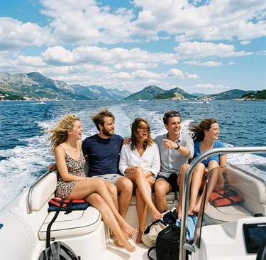 Happy group of friends laughing on private speedboat cruising the Adriatic Sea near Split
