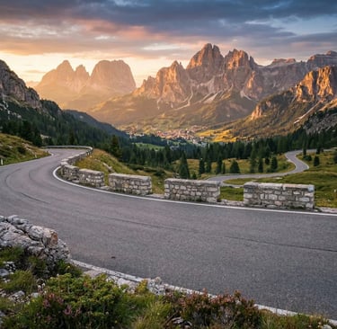 Winding mountain road with stone barriers, Dolomite peaks and Cortina valley at golden hour