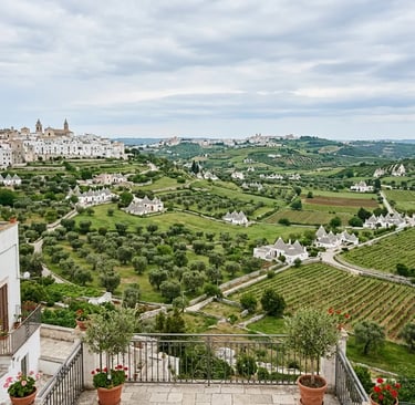 Panoramic view of Valle d Itria with olive groves vineyards and trulli from Locorotondo terrace