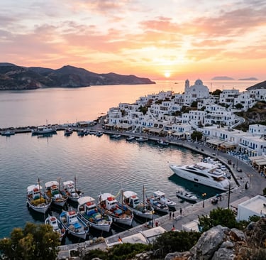 Adamas harbor in Milos at sunset with fishing boats and whitewashed village on the hillside