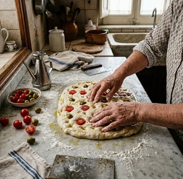  Hands pressing cherry tomatoes and olives into focaccia barese dough in a Bari kitchen