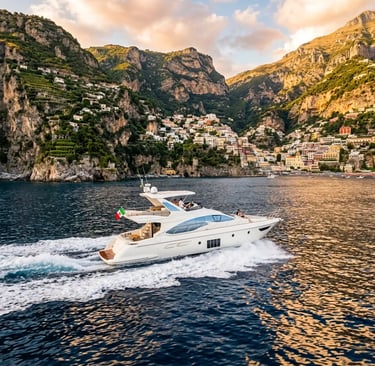 Luxury Azimut yacht cruising along the Amalfi Coast near Positano at golden hour