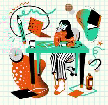 a woman sitting at a desk with a laptop and a notebook