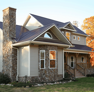 a house with a stone chimney and a chimney