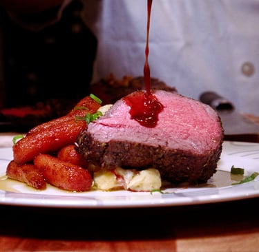 Sauce poured on rare steak