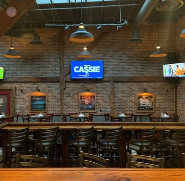 Trip TVs installed by At Hand Heroes in Glendale sports bar with reinforced mounts and hidden cords.