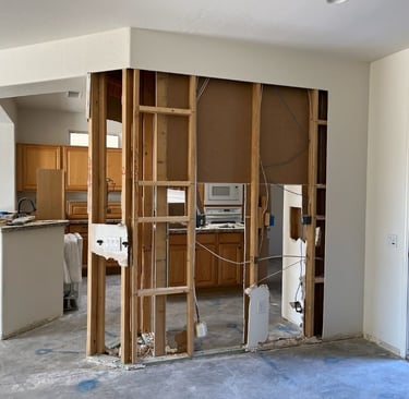 Kitchen wall removal and drywall repair project in Sun City West, AZ by At Hand Heroes.