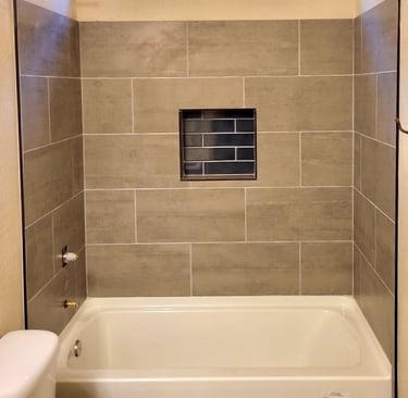 Modern tile shower renovation by At Hand Heroes in Surprise, AZ