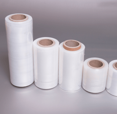 a group of white plastic stretch rolls wrappers with a variety of different sizes and colors
