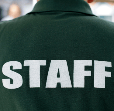 a staff staffer in a green uniform
