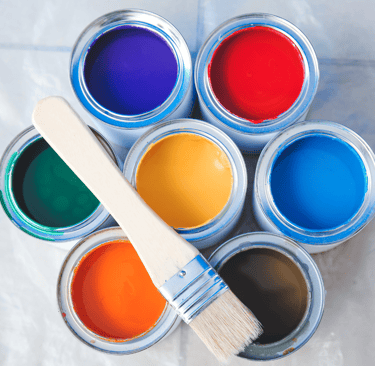 a paintbrush and paints with different types and colors